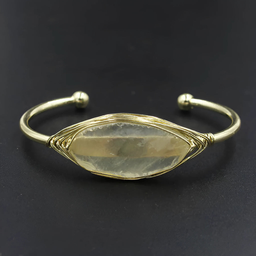 Raw gemstone bracelet with rough 8mm crystal beads in amorphous shapes on wrist, showing unisex ethnic style.