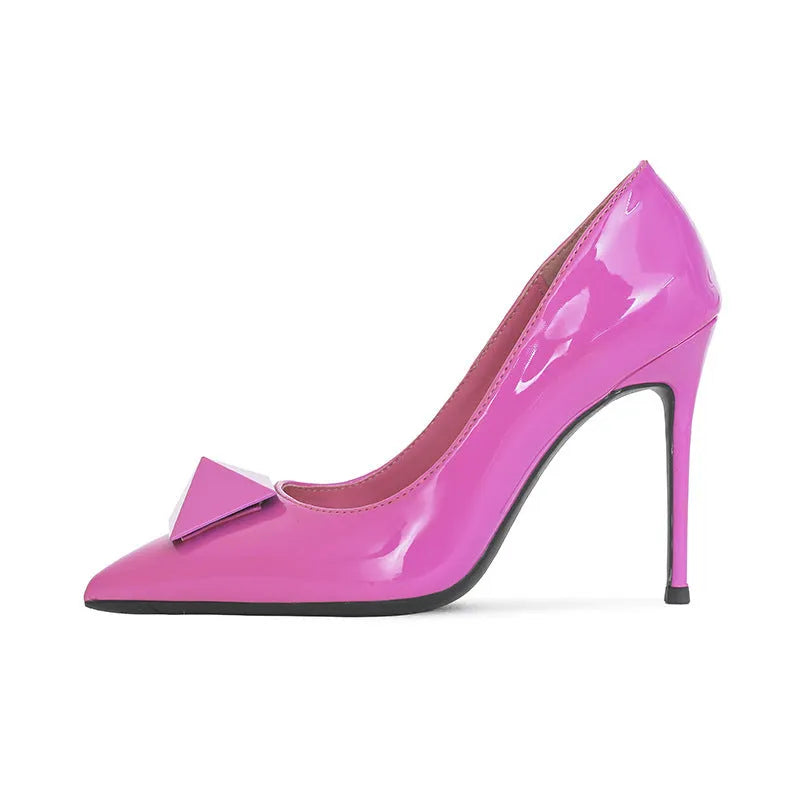 Pink women's pointed toe stiletto high heels with a buckle fastening on a patent leather upper.
