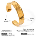 Stainless steel wings motif ring with an open gap design on a plain background