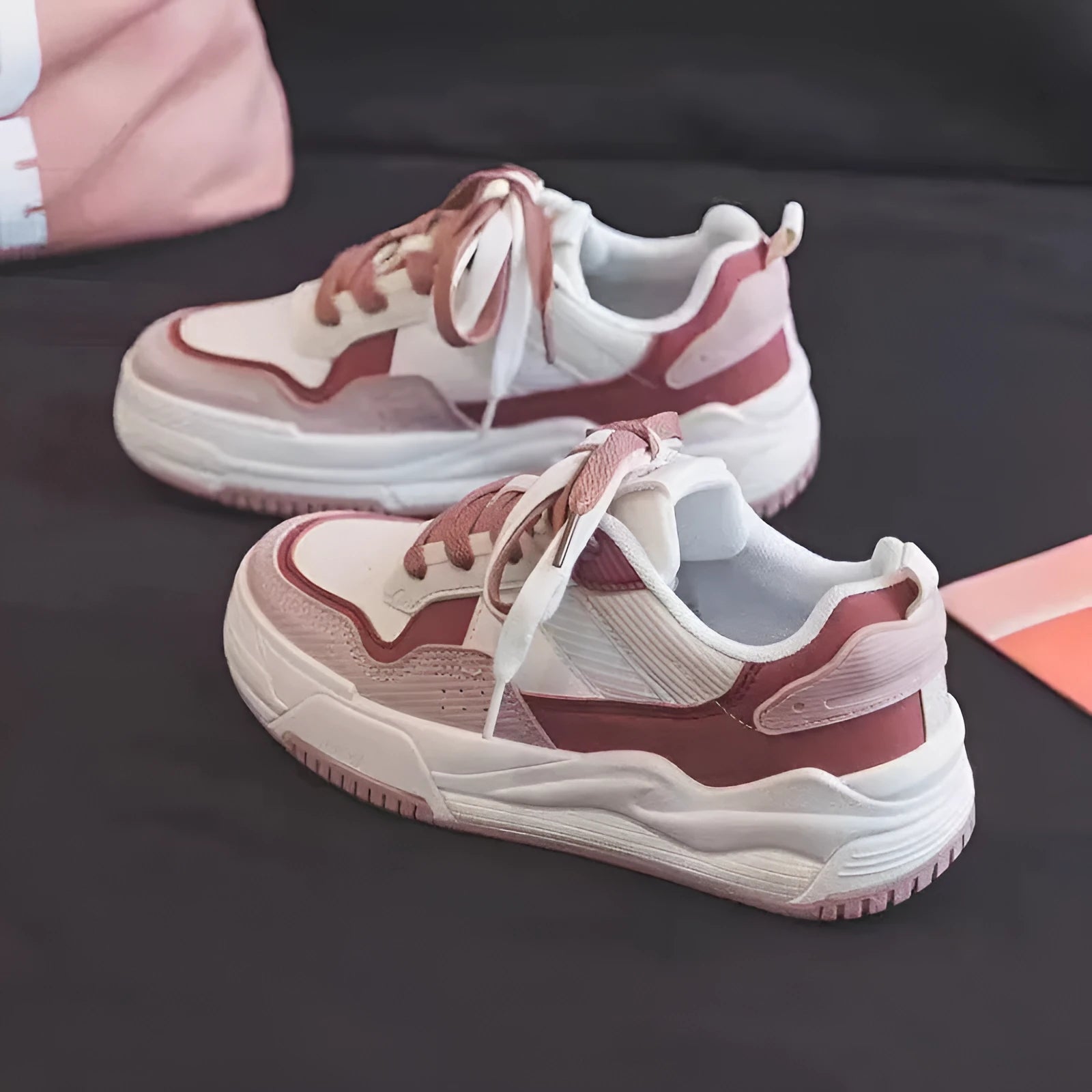 Women's pink and white low-top rubber sneakers with height increasing soles