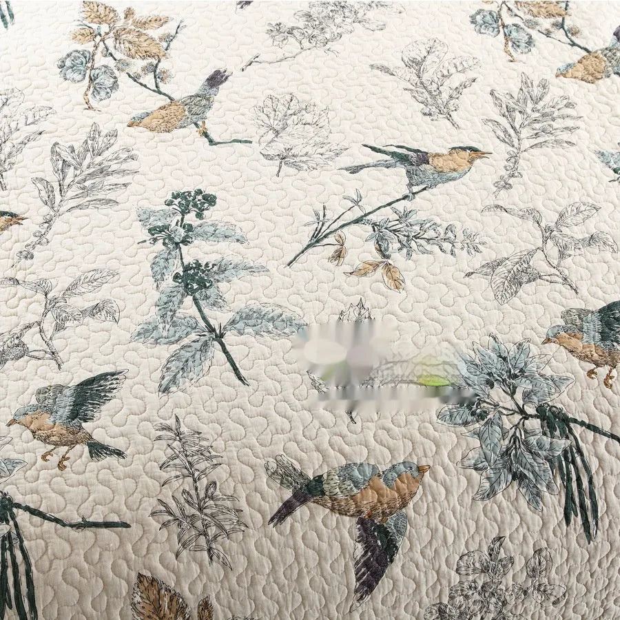 Quilted pure cotton bed cover set with printed pattern on a bed