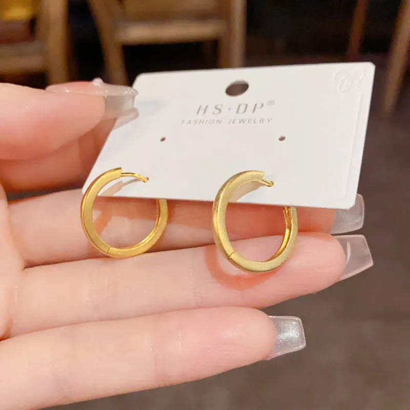 Geometric simple style gold or silver colour clip-on earrings for women with round eyelet design.