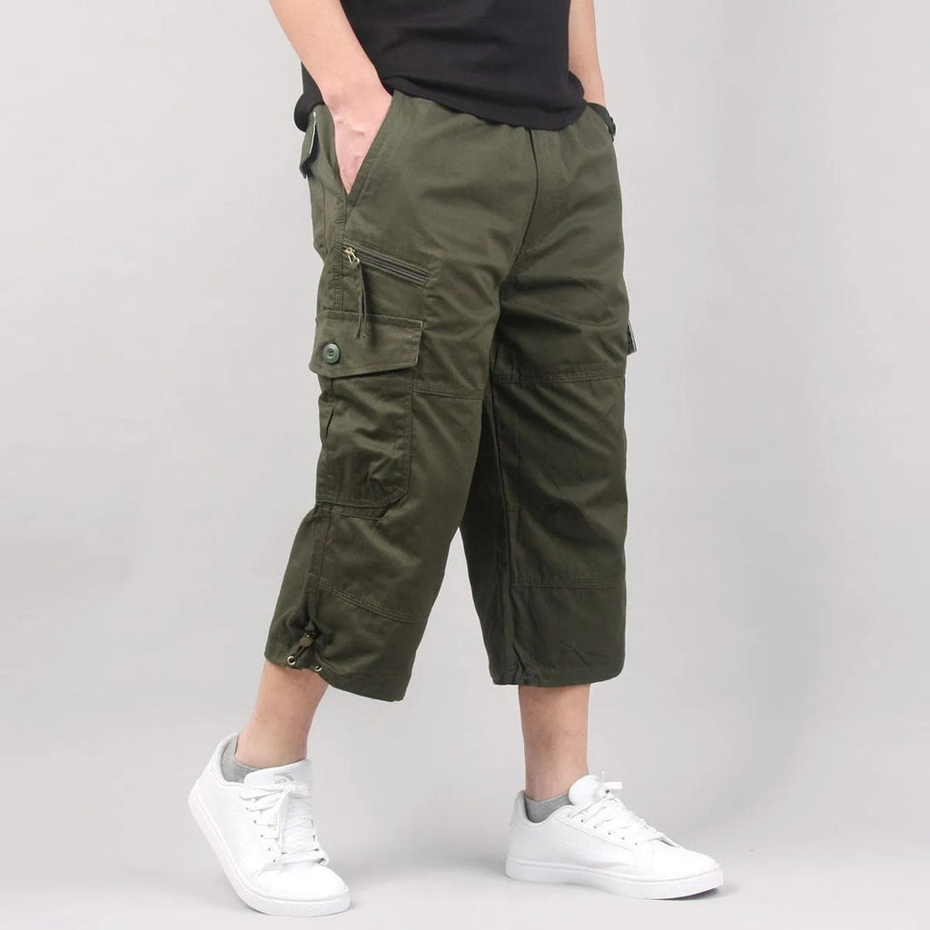 Men's casual cotton cropped pants in loose fit available in khaki, black, dark grey, and army green colours