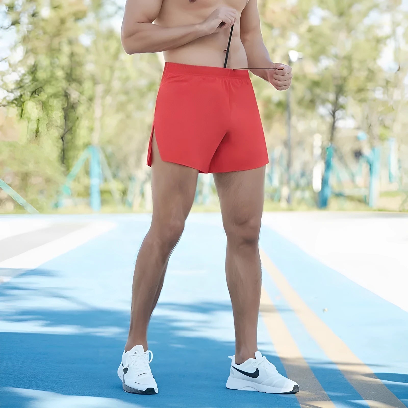 Men's black off-road running shorts with a loose fit and high waist, shown for running activity.
