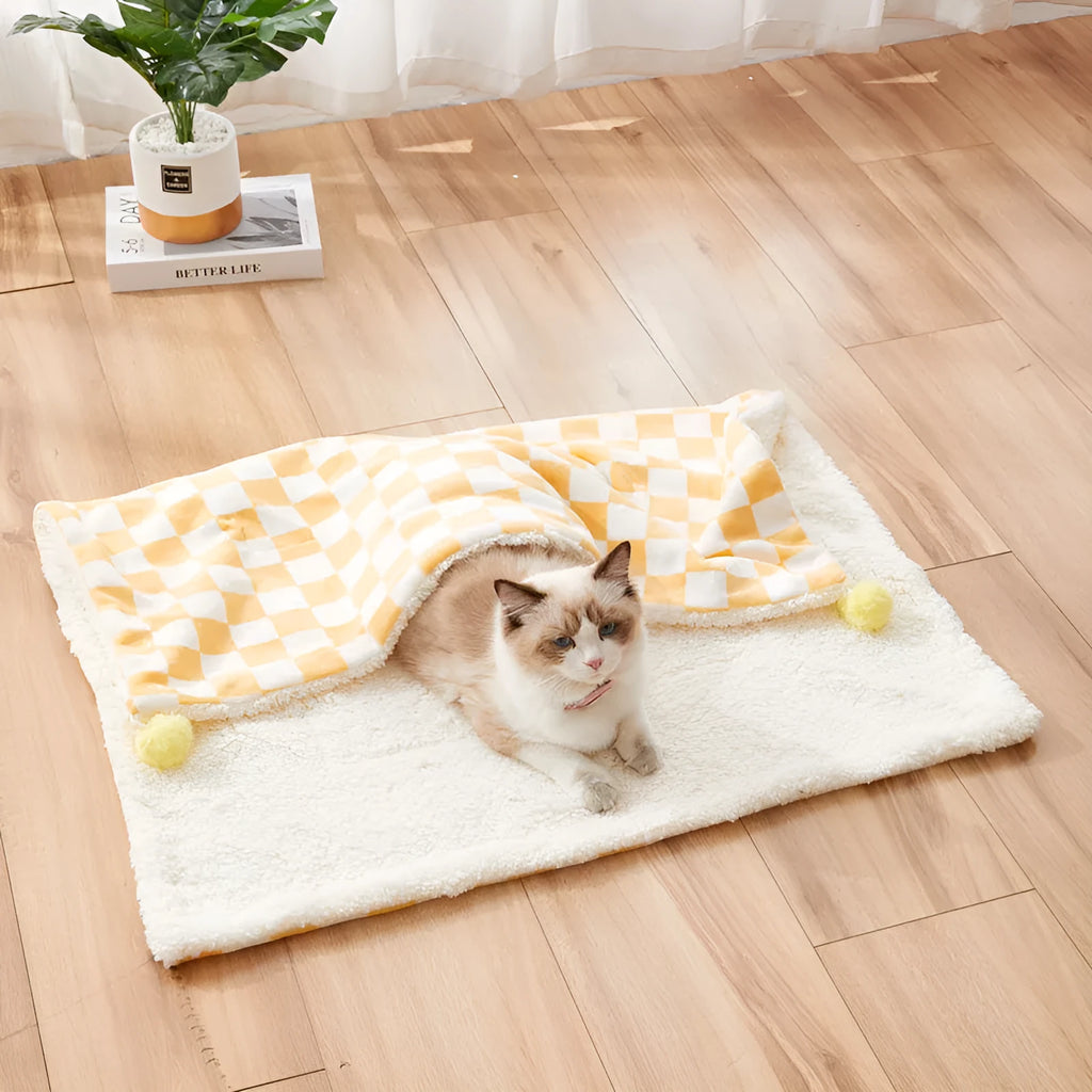 Plaid pattern pet blanket with fur ball decoration in green, pink, or yellow colours on soft fleece material
