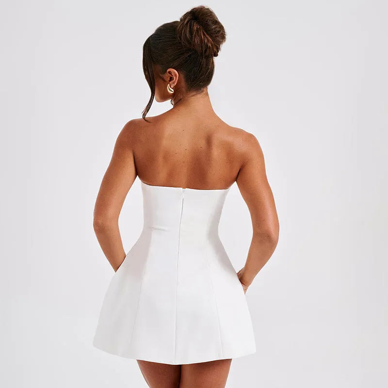 Women's black backless tube dress with high-waist A-line short skirt on a mannequin.