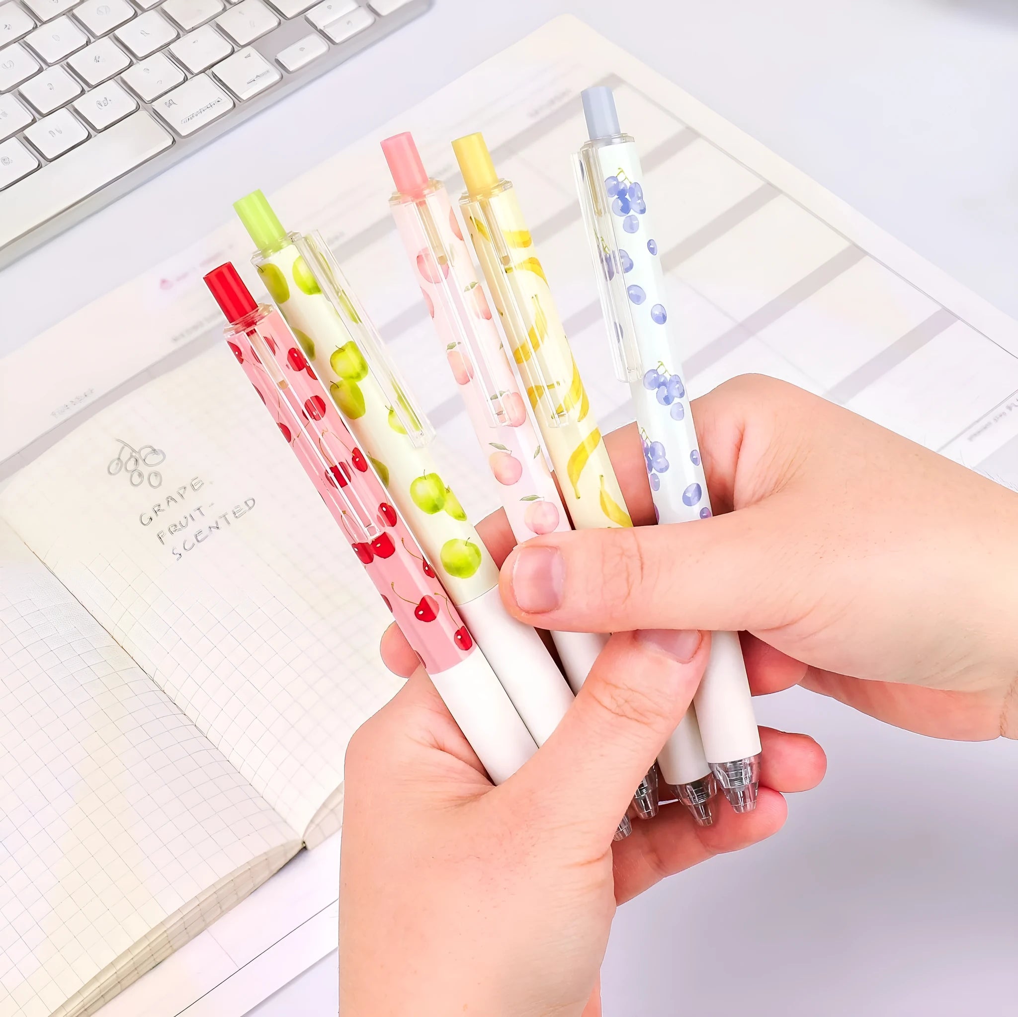 Three scented fruit flavoured pressurised pens with 0.5mm black ink and plastic barrels