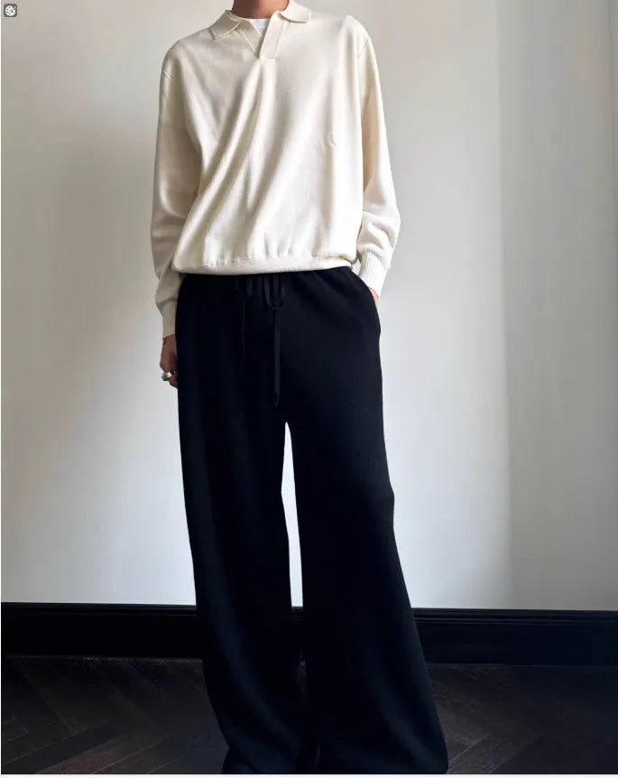 Pure wool lapel-collar polo sweater in a loose fit, shown in milky white.