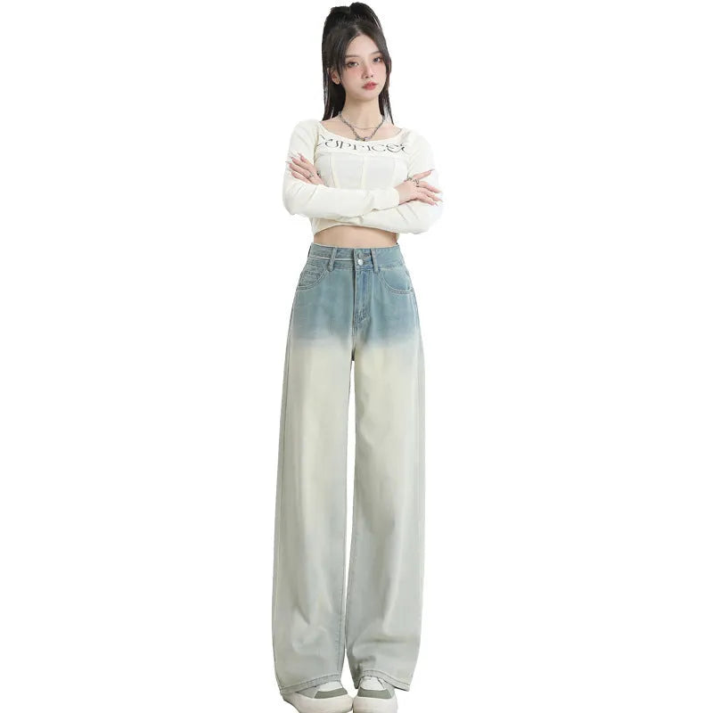 Women's gradient blue straight-leg denim trousers with wide leg design showing colour transition effect