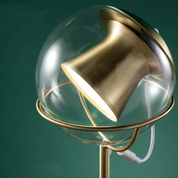 Glass desk lamp with dimmable touch switch and LED light source on desk surface