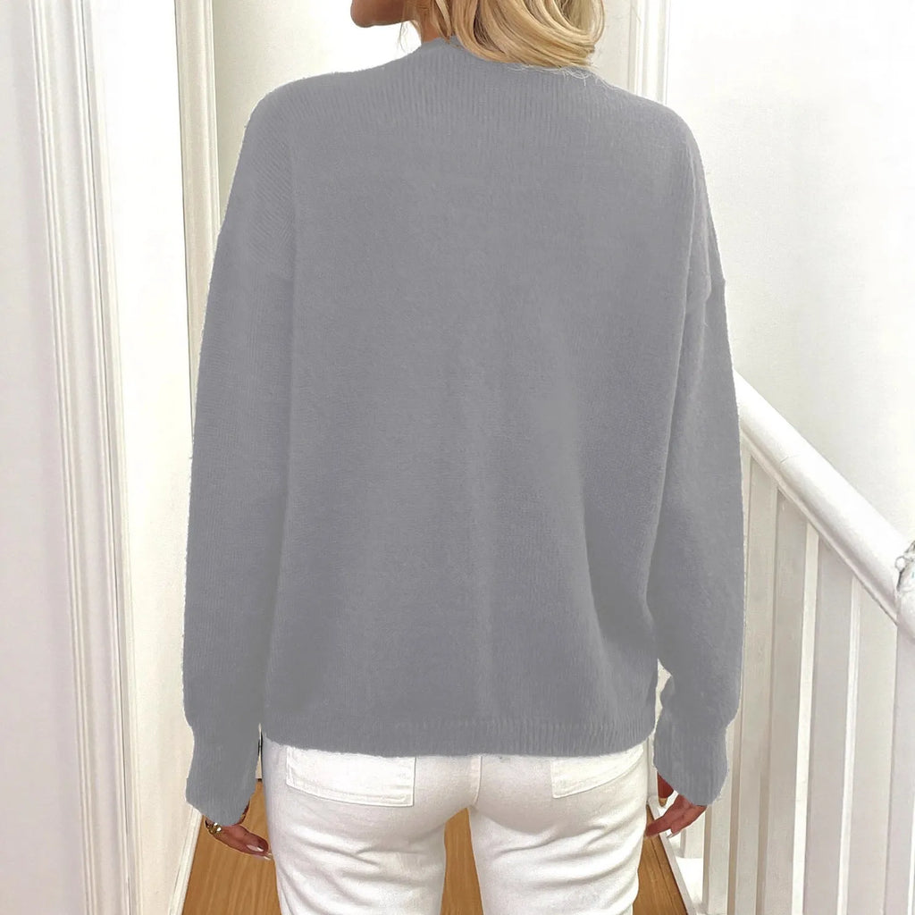 Women's deer plush sweater coat with princess sleeves in black colour showing irregular cut design