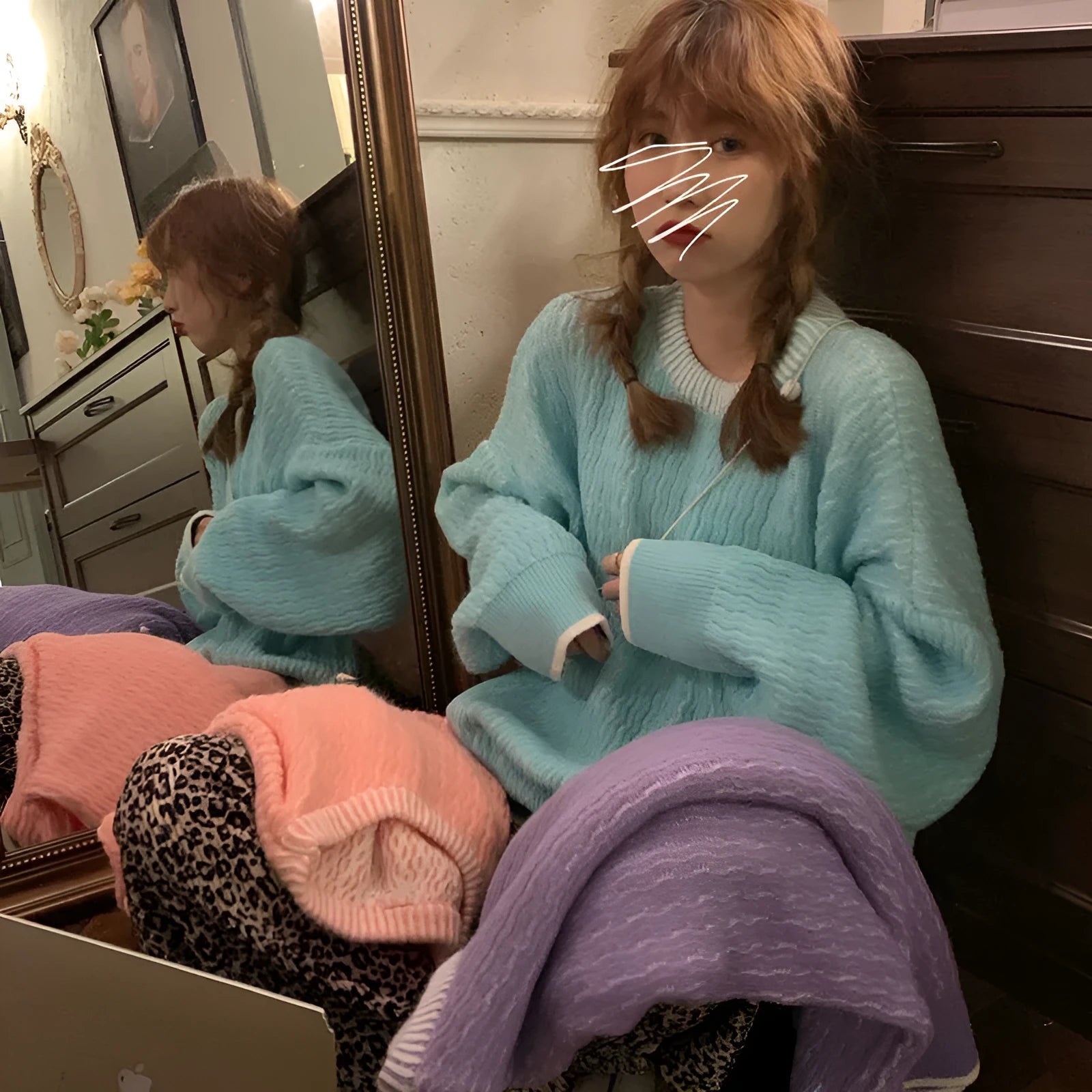 Women's loose pullover sweater in lake blue colour showing regular sleeves and solid colour design