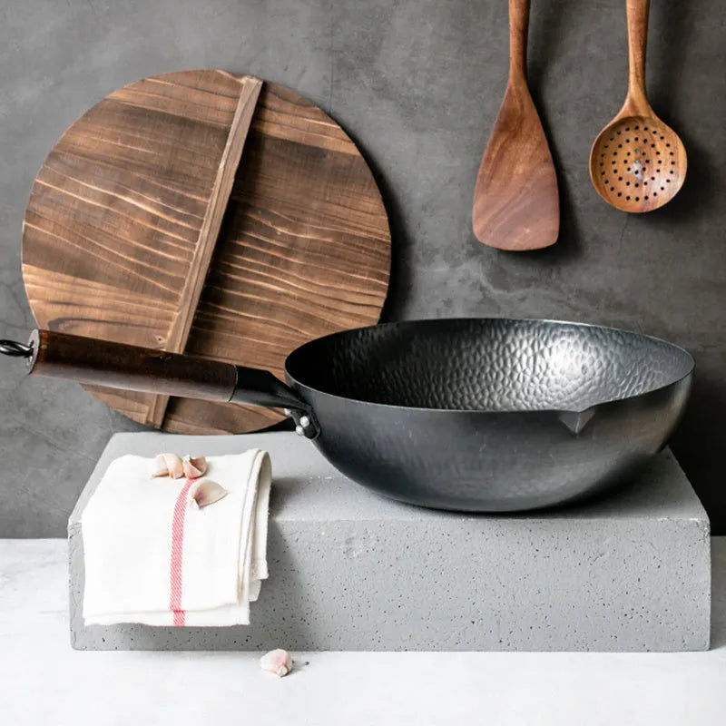 Black handmade traditional iron wok with wooden handle, 32cm diameter with lid.