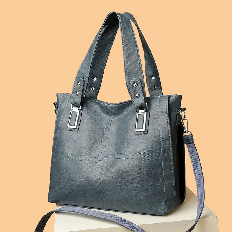 PU women's handbag in black with horizontal square shape and sewing thread details