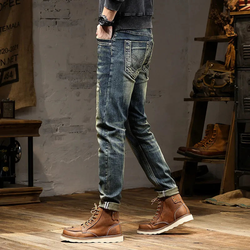 Men's skinny fit jeans in a retro colour with a zip fly, shown laid flat.