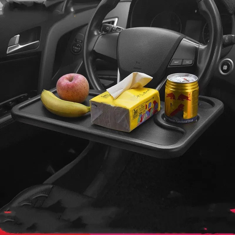 Black plastic car desk with computer workspace and integrated plate storage compartments