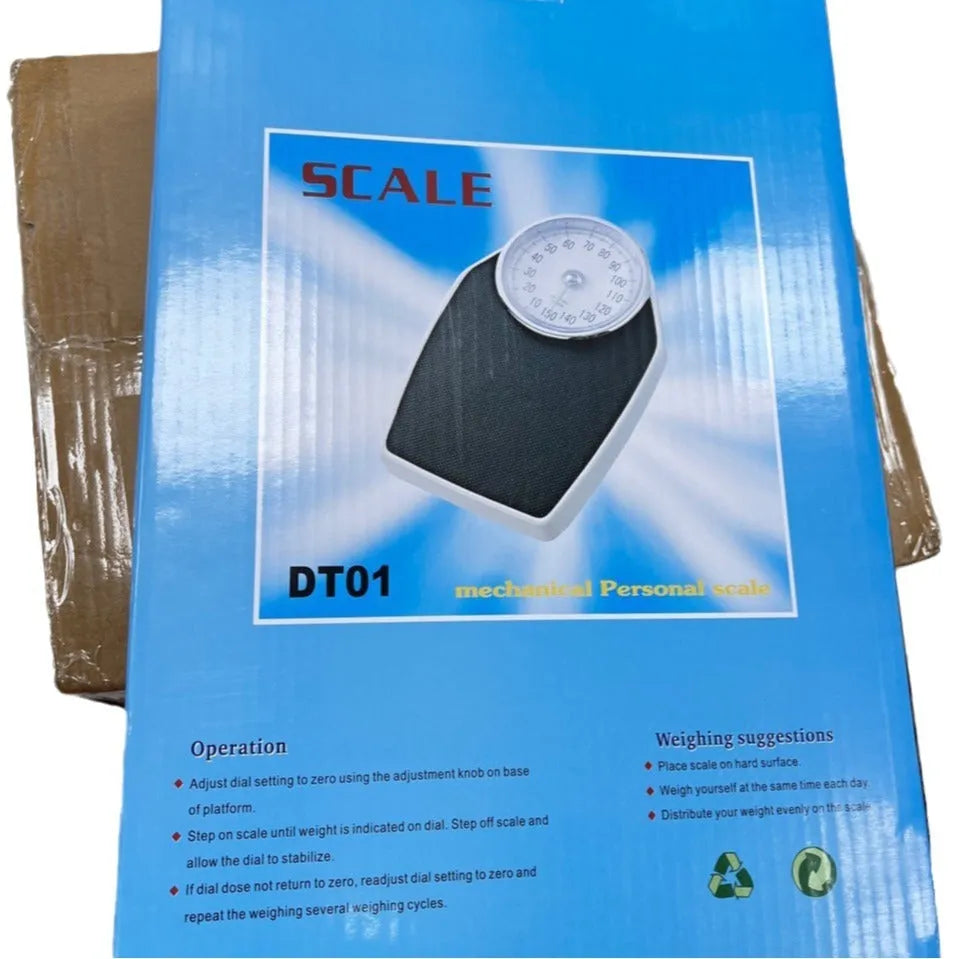 Black mechanical bathroom scale with large analogue dial showing weight measurement