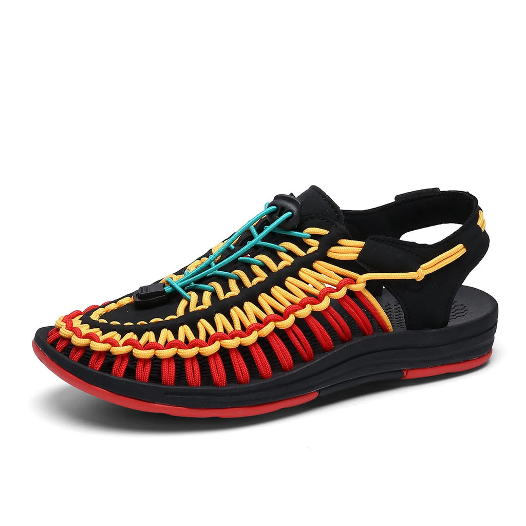 Casual woven sandals with drawstring tie closure in a rainbow colour pattern on a rubber sole.
