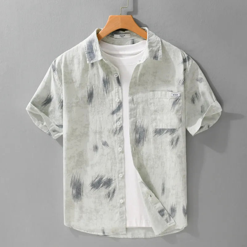 Men's light green floral print cotton cardigan with short sleeves on a hanger