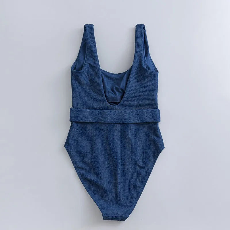 Navy blue women's one-piece triangle swimsuit with removable chest pads for swimming