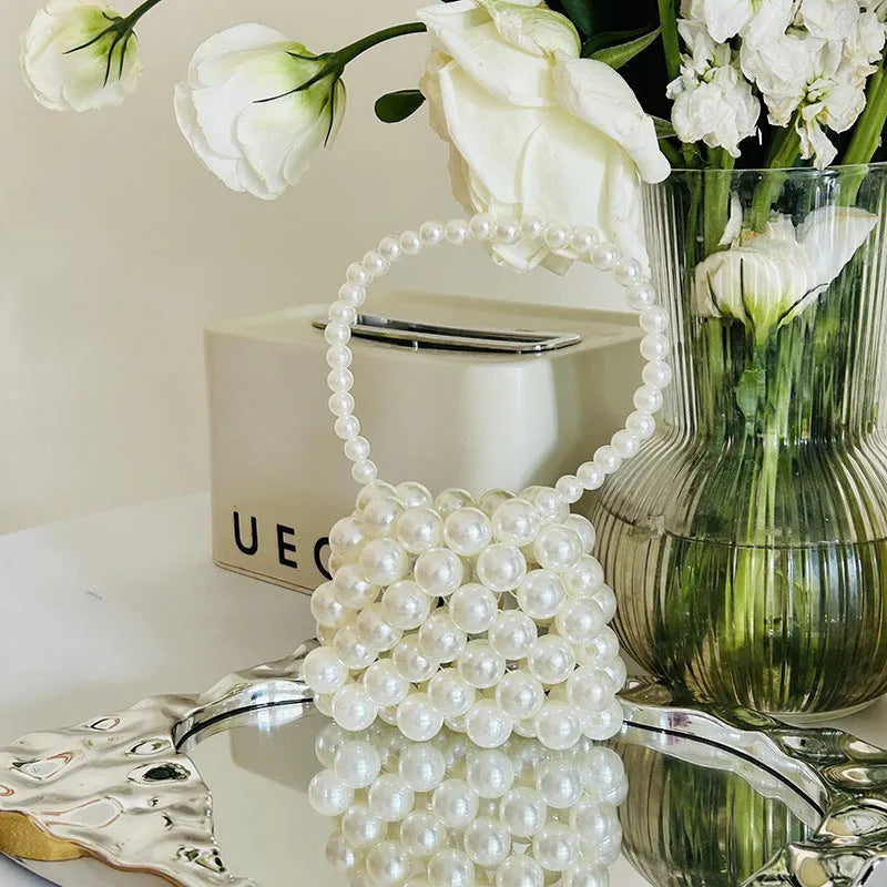 Women's imitation pearl mini crossbody handbag with geometric pattern in a pearl tote colour.