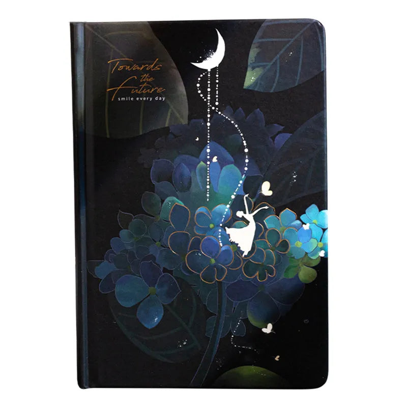 A5 notebook with luminous blue cover open to show colour illustration pages inside