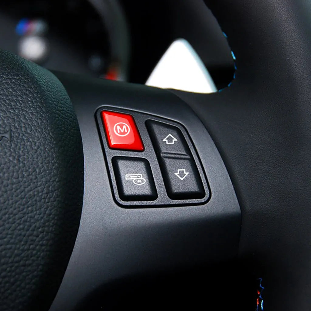 Pair of red and blue BMW steering wheel M1 M2 mode button accessories made from ABS plastic.