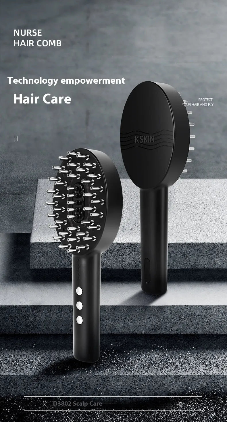 Handheld black scalp massage device with charging cable on a white background.