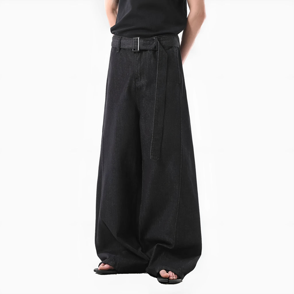 Black high waisted straight leg jeans with gold accents and zip fly opening