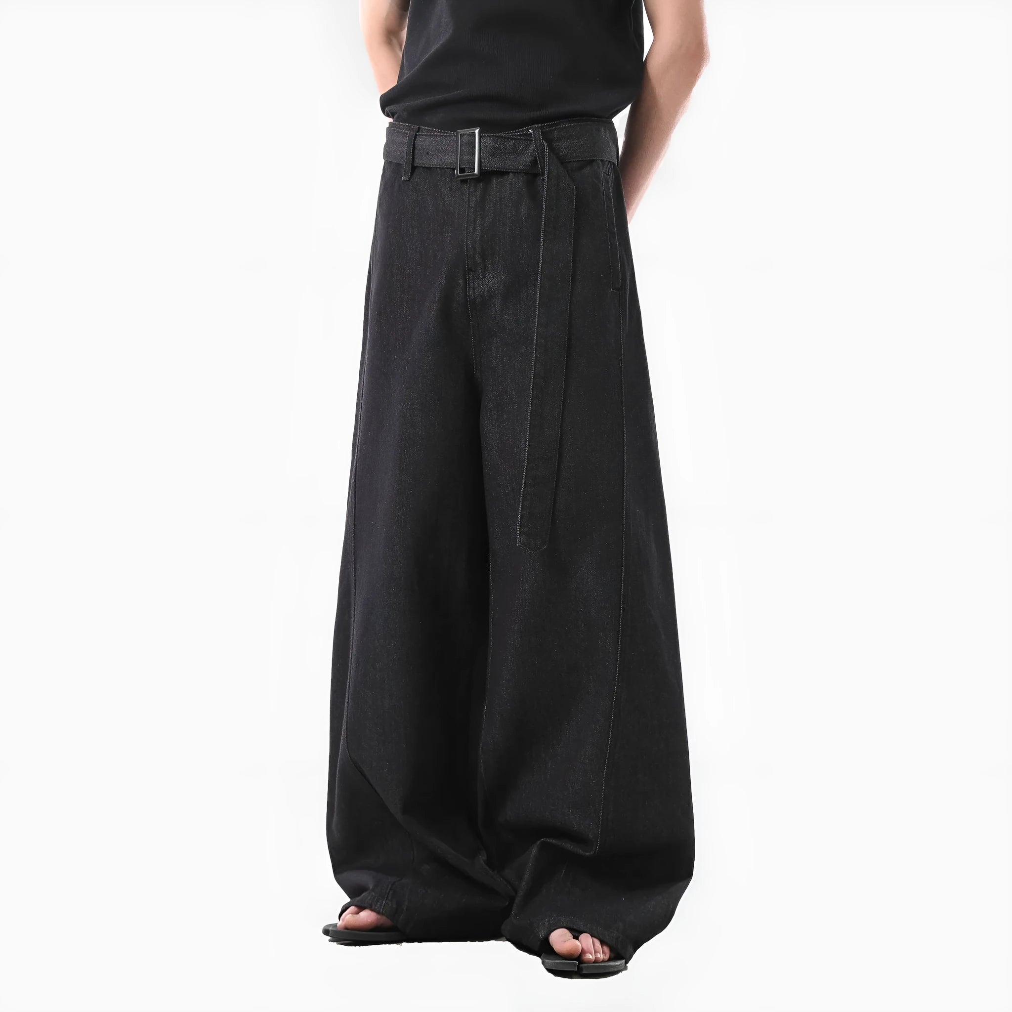 Black high waisted straight leg jeans with gold accents and zip fly opening