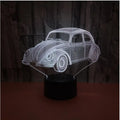 Black LED table lamp with colourful acrylic shade and remote control on wooden desk