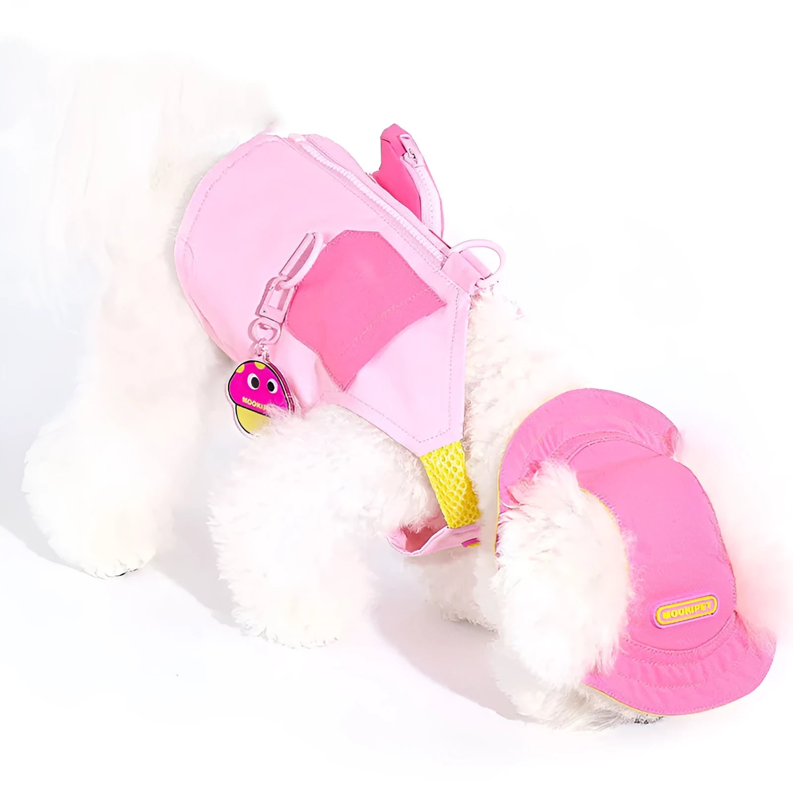 Pink polyester pet vest for small to medium dogs on a Bichon Frise