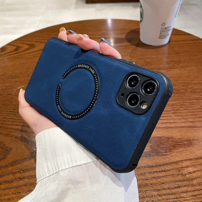 Black imitation leather magnetic charging case for iPhone on a table.