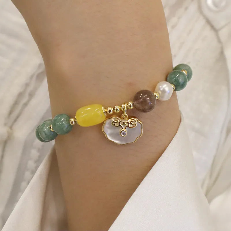 Green jade shell bracelet on a wrist showing natural stone beads and 18 cm length.
