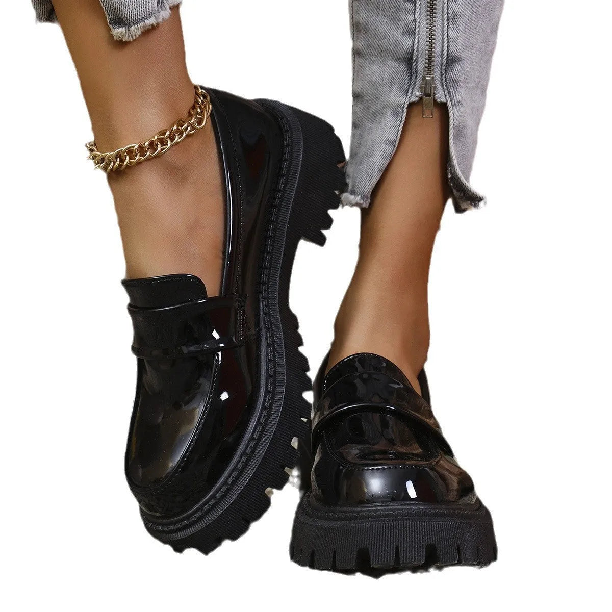 Plus size black chunky heel loafers with a thick rubber sole and slip-on design.