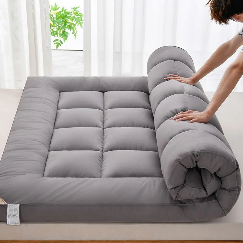 Thickened three-dimensional feather velvet mattress sheet in alpaca colour on a bed