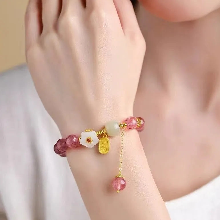 Handcrafted strawberry quartz crystal bracelet with Hetian jade peach blossom design for women