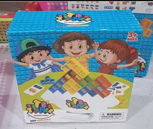 Plastic balance stacking game with coloured blocks on chassis for family play