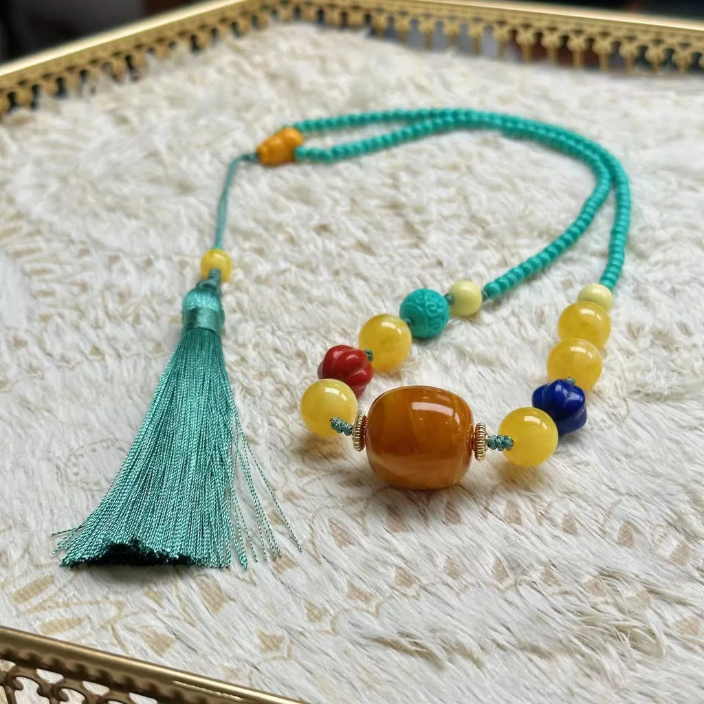 Hand-woven turquoise mesh flower pendant necklace on ball bead chain with adjustable length