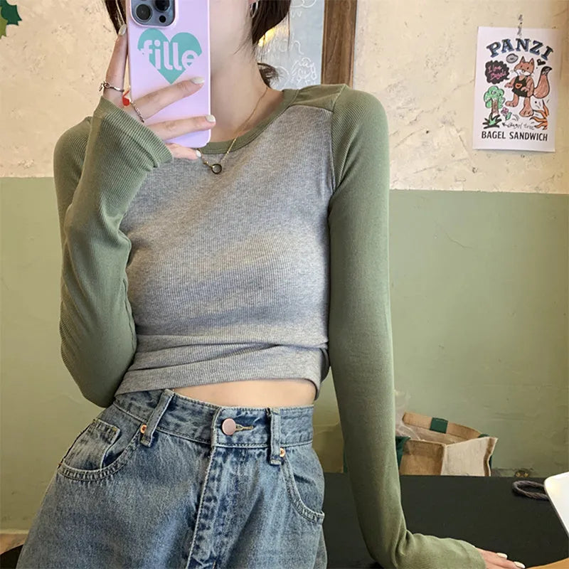 Women's dark blue slim fit casual top with long princess sleeves and embroidered front detail.