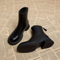 Women's black ankle boots with thick flat heels and back zipper fastening