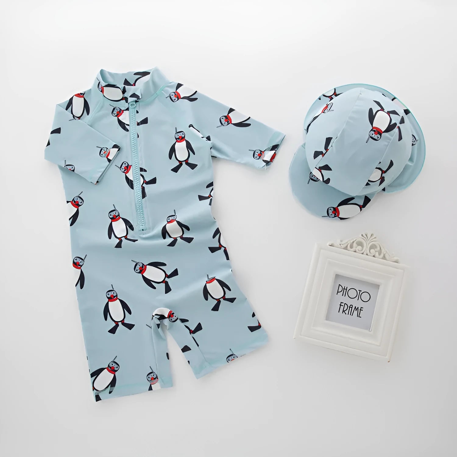 Boys' penguin print long sleeve swimming costume set with matching swim cap for sun protection