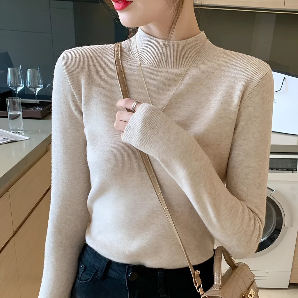 Slim fit long sleeve knitted shirt in viscose fibre shown in apricot colour.