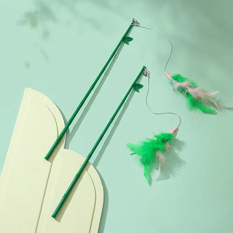 Green interactive cat feather wand toy with bells and durable construction for playful stimulation