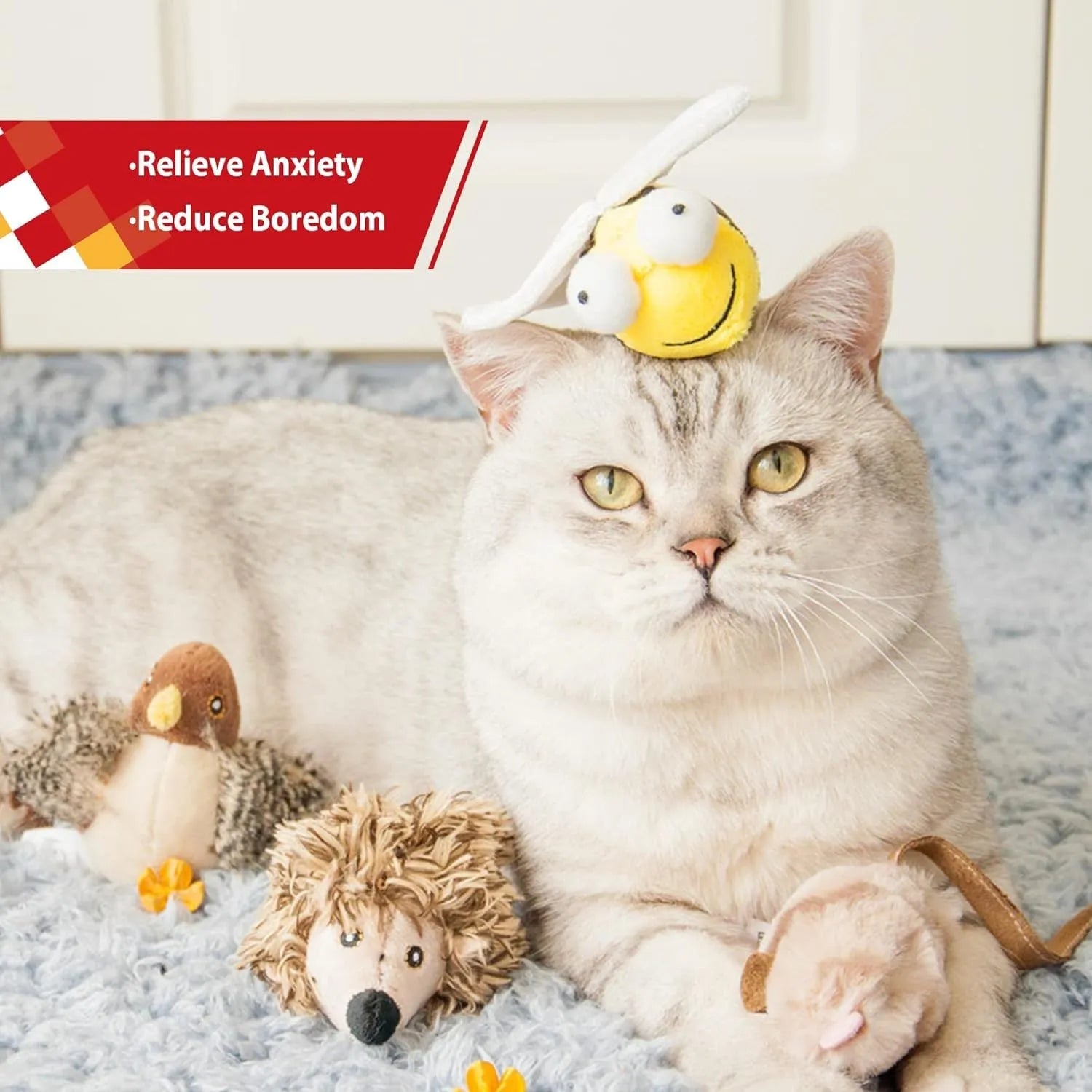 Yellow bee-shaped electronic cat toy with flannelette fabric on wooden surface