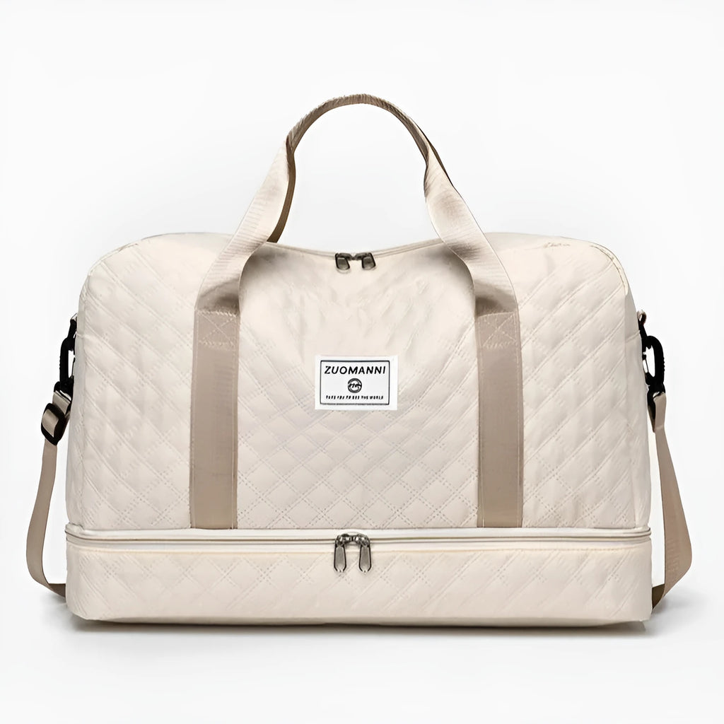 Large Oxford cloth travel bag in a solid colour with contrast stitching, shown with buggy and travel items.
