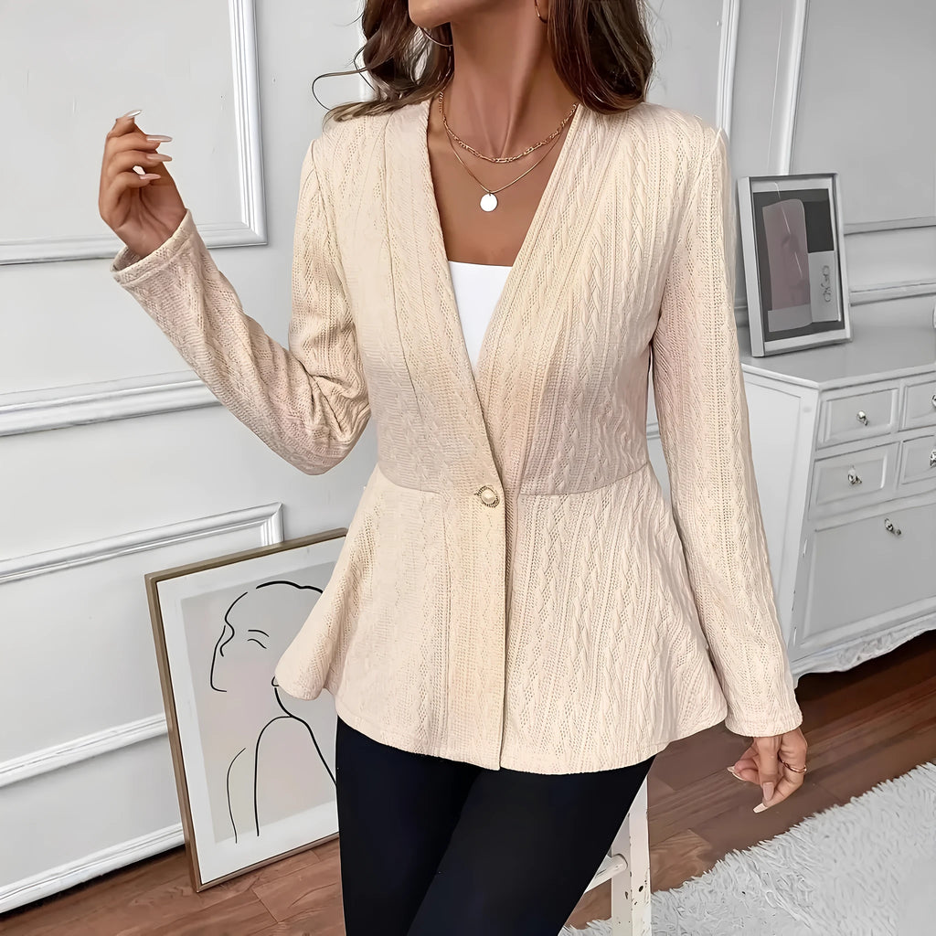 Women's apricot coloured knitted cardigan with one button and a textured Jacquard pattern