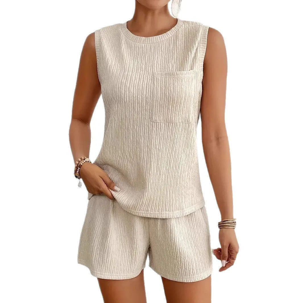 Women's apricot polyester sleeveless vest and matching shorts laid flat