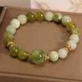 Women's bracelet made of green Xiuyan jade with an original sweet Mori style design.