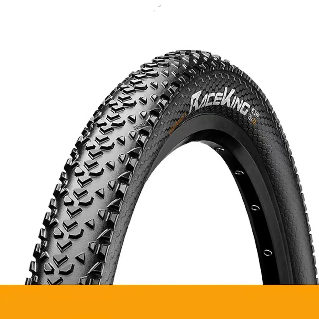 Mountain bike outer tyre showing yellow sidewall, with folding bead and tread pattern for off-road use.